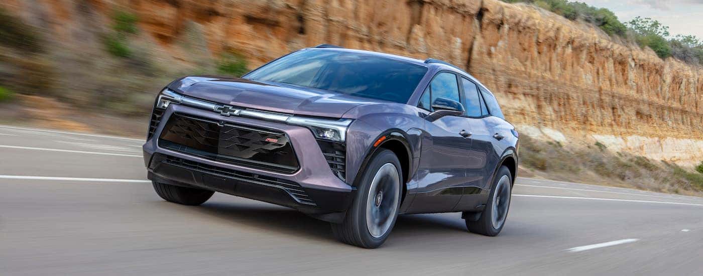 A grey 2025 Chevy Blazer EV from the front after leaving a dealer that has EVs for sale.