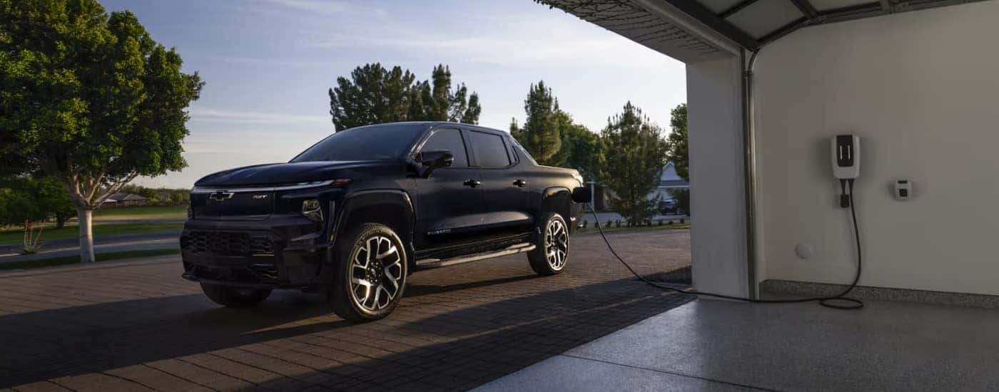Black 2025 Chevy Silverado EV RST charging after looking at EVs for sale in Richmond.