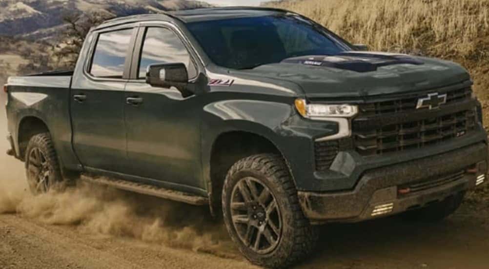 A green 2026 Chevy Silverado 1500 Z71 off-roading.