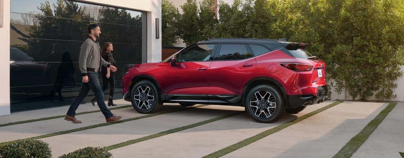 A red 2023 Chevy Blazer from the side.