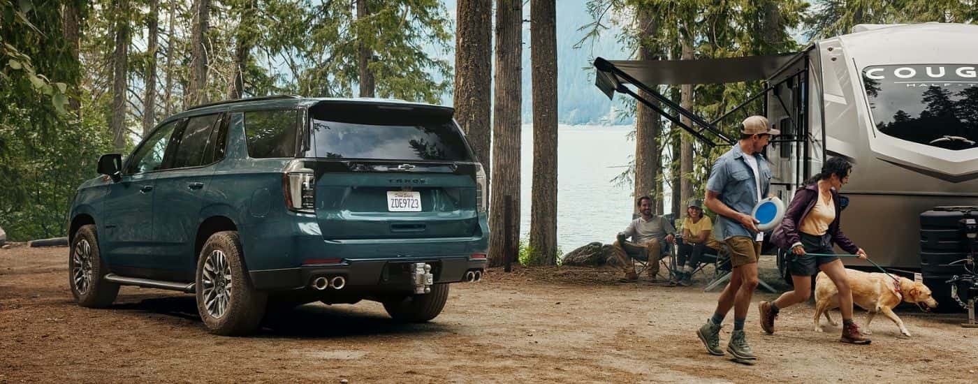 Green 2026 Chevy Tahoe Z71 parked at a campsite