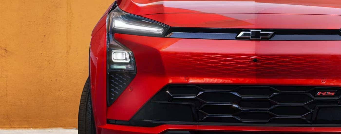 Close-up on the front of a red 2027 Chevy Bolt RS