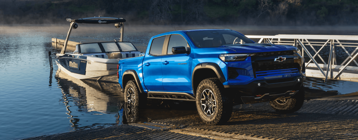Blue 2026 Chevy Colorado ZR2 towing a boat