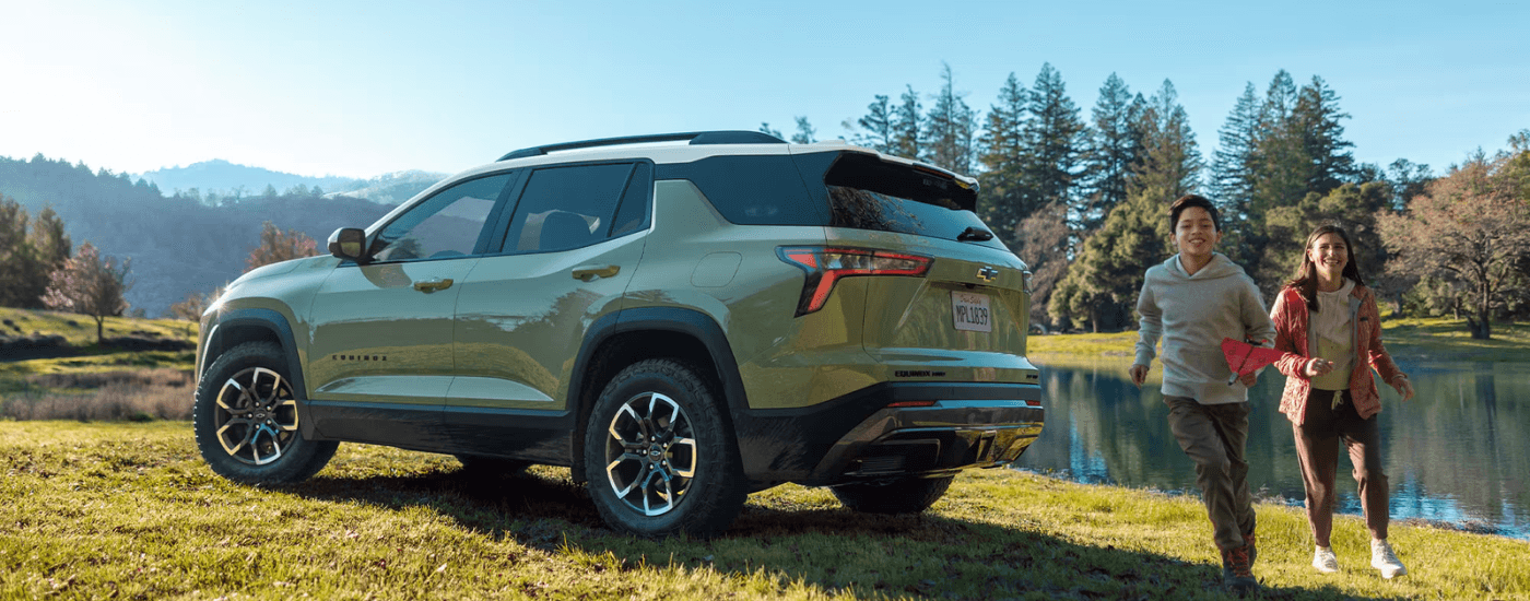 Green 2026 Chevy Equinox parked in a field