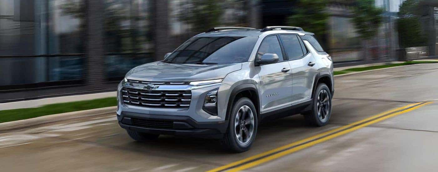 Silver 2026 Chevy Equinox driving along a coast