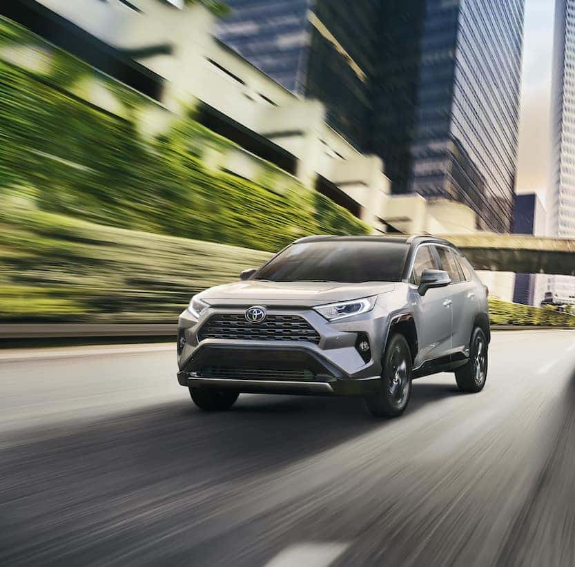 A Toyota Hybrid for Everyone at Penn Toyota | 2020 Toyota RAV4 Hybrid driving on city highway