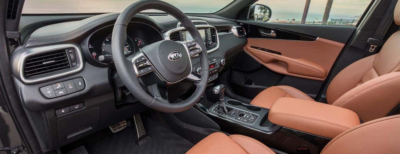 The black and brown interior of the 2020 Kia Sorento is shown.