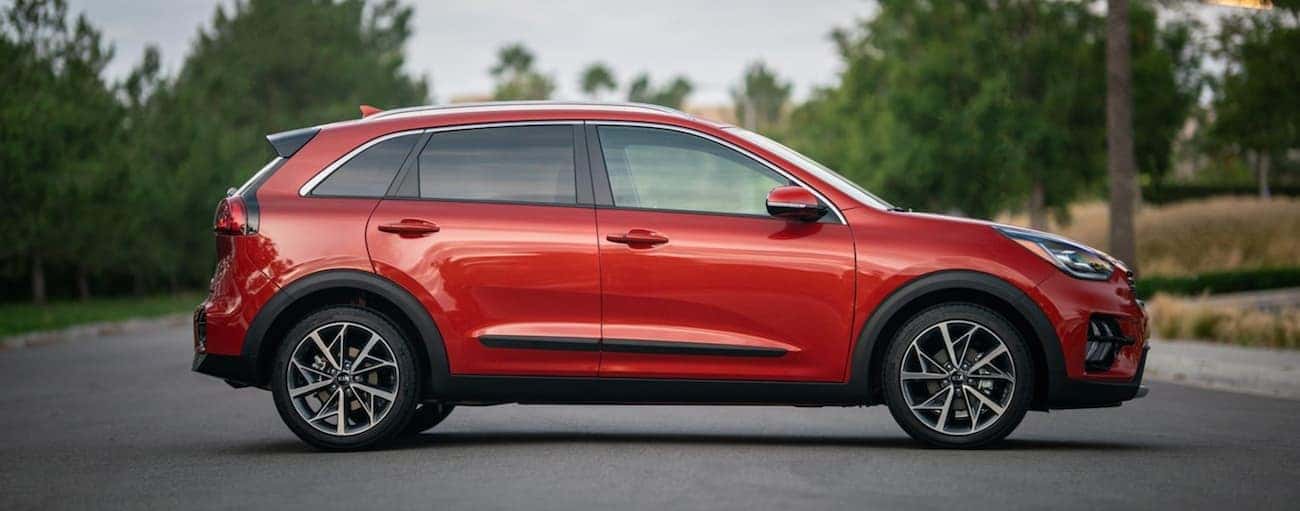 A red 2020 Kia Niro is shown from the side.