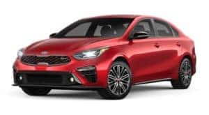 A red 2020 Kia Forte is facing left.