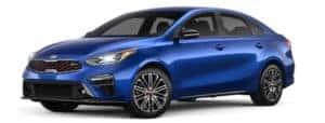 A blue 2020 Kia Forte is angled left.