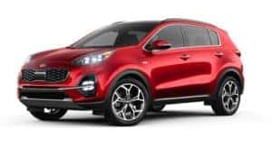 A red 2021 Kia Sportage is angled left.