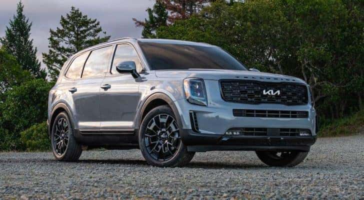 A silver 2022 Kia Telluride is shown parked on gravel after visiting a NJ Kia dealership.