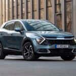 Kia Sportage stopped on a street. This model is one of the most popular compact SUV vehicles in Europe.