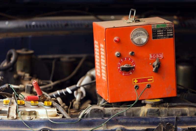 Car battery electrical charger in use