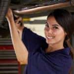 female mechanic fixing a vehicle