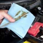 Mechanic checking the oil