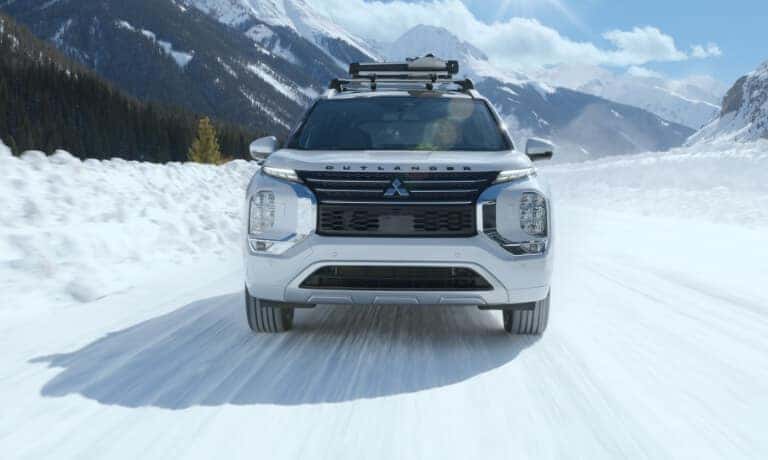 2025 Mitsubishi Outlander PHEV Exterior Driving In Snow Head On