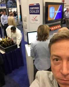 Jay Mealey takes a celebratory selfie while the Dealers of the Year were announced at NADA 2015.