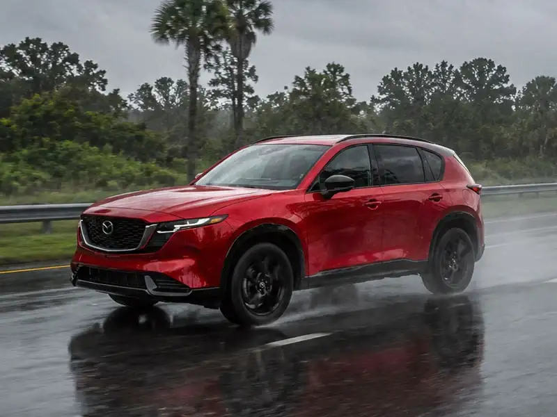 2026 Mazda CX-5 with i-Activ AWD driving on a wet Central Florida road near Orlando