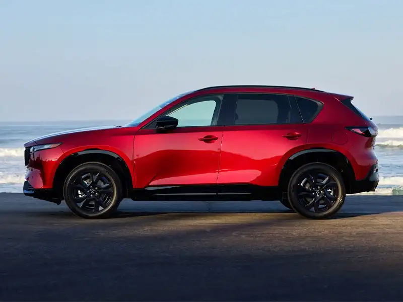 Side profile of the redesigned 2026 Mazda CX-5 showing its longer wheelbase, at Sport Mazda South in Orlando, Florida