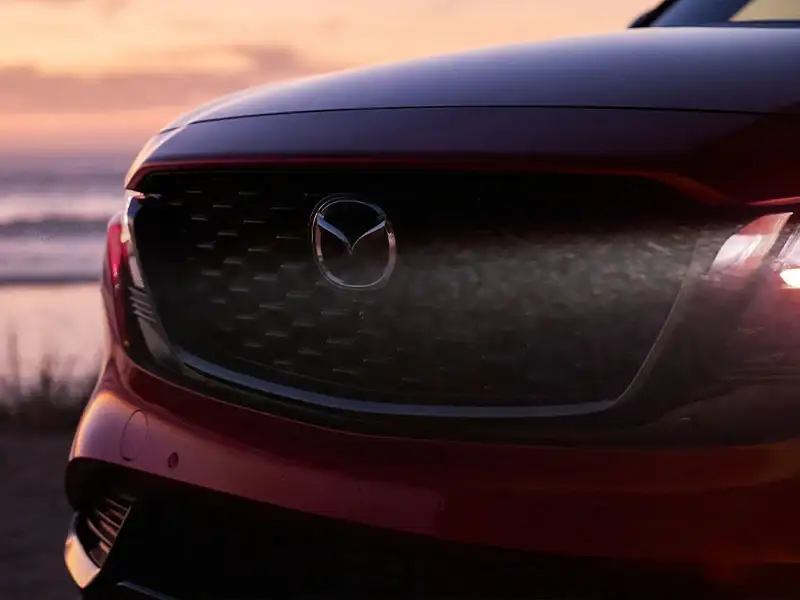 Front grille and signature wing detail of the 2026 Mazda CX-5 at Sport Mazda South in Orlando, Florida