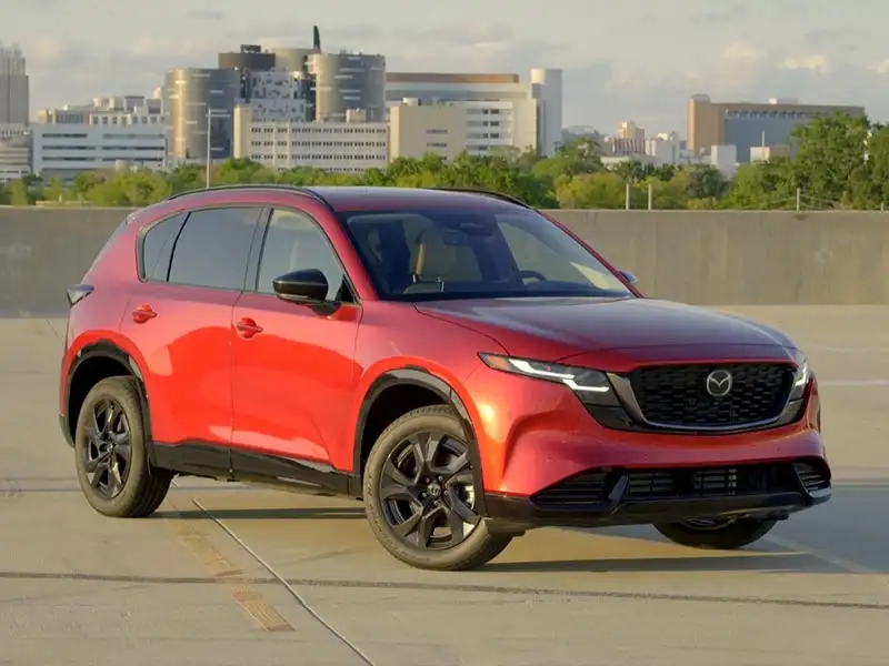 2026 Mazda CX-5 in Soul Red Crystal Metallic, front three-quarter view, at Sport Mazda South in Orlando, Florida