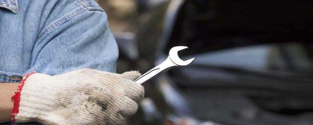 Car technician holding the wrench