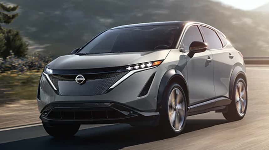 Silver Nissan SUV driving on the highway