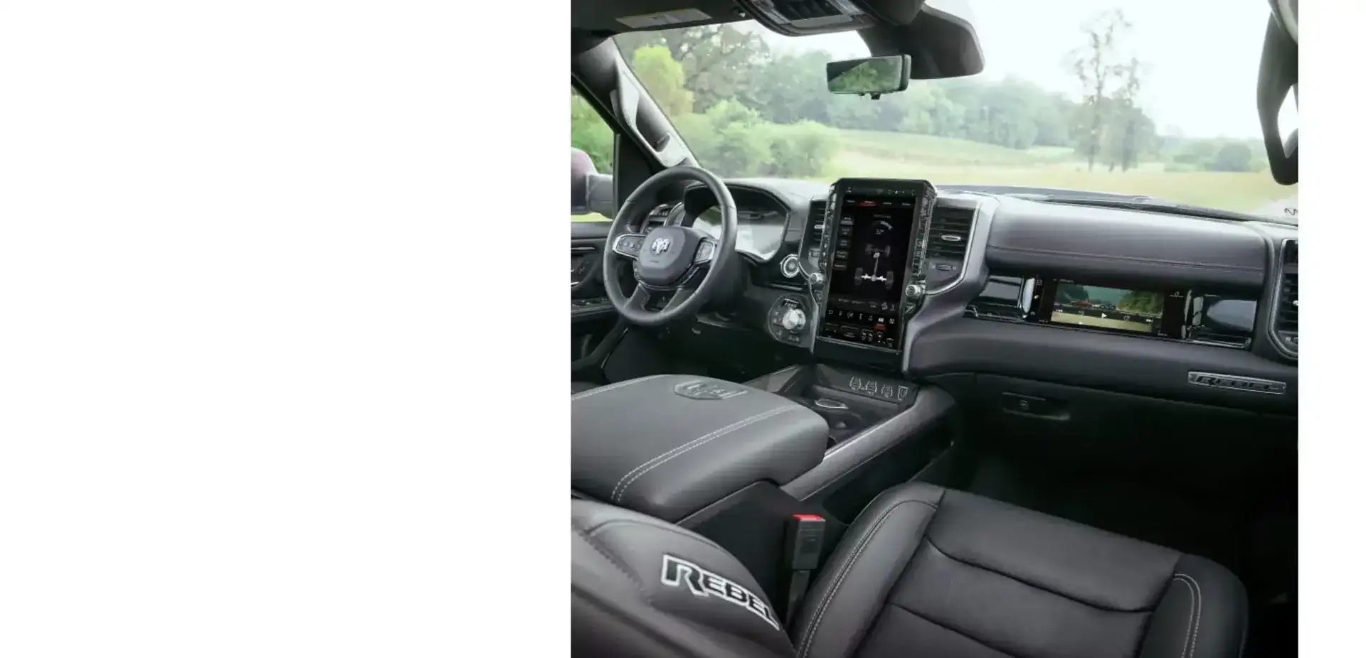 Interior of a Ram 1500 Laramie Crew Cab with driver display and Uconnect touchscreen