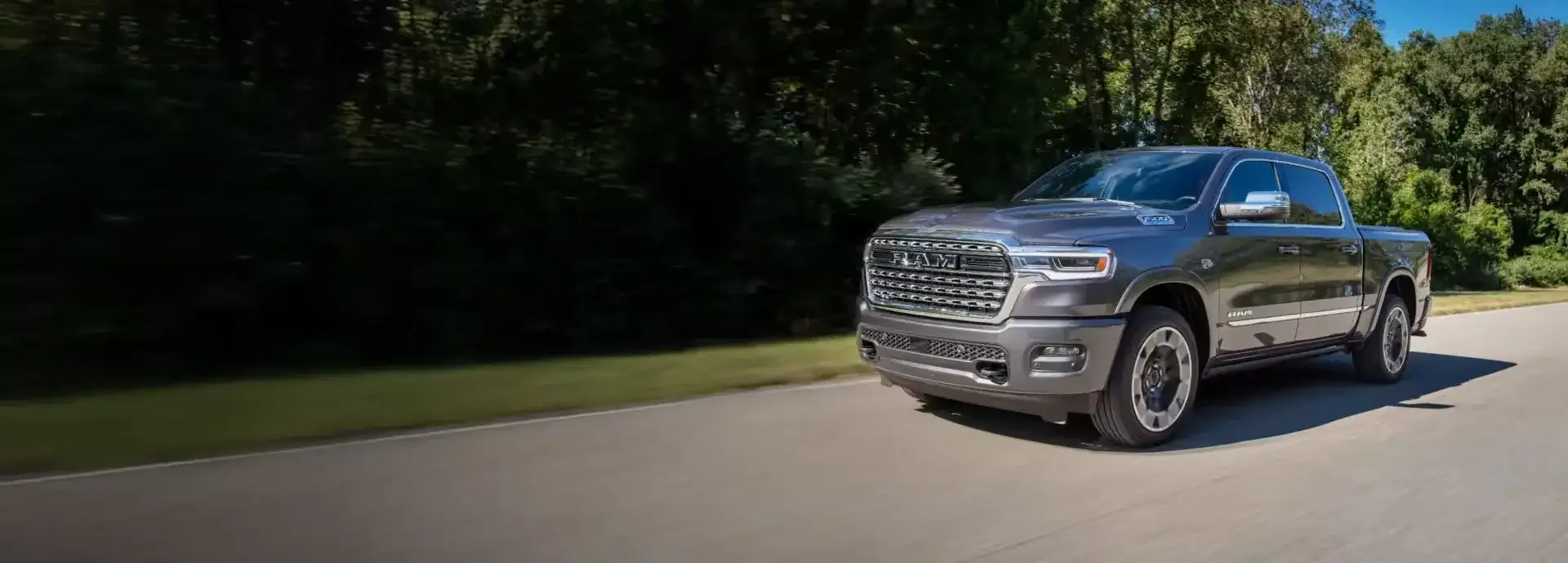 Ram 1500 Limited driving on a country road
