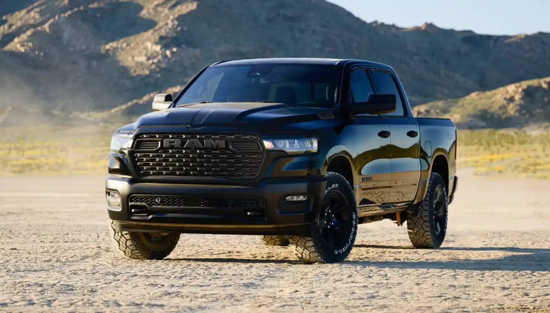 Black Ram 1500 Warlock driving across rugged off-road terrain