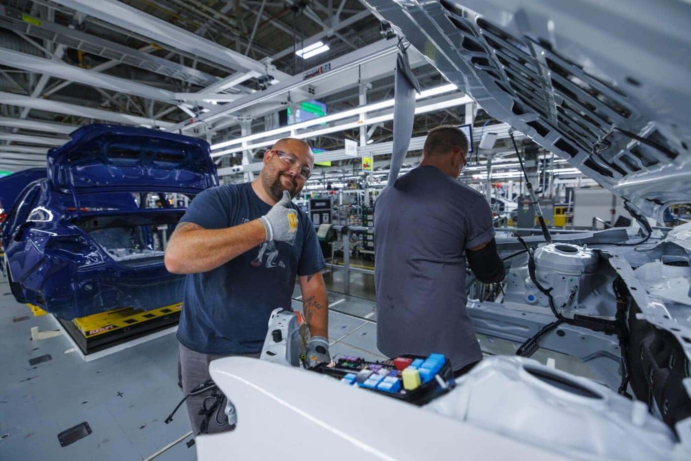 Toyota Kentucky team members working on a vehicle assembly line