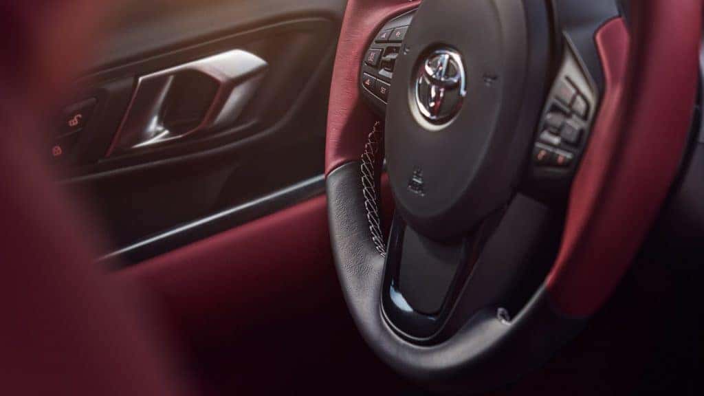 Red steering wheel in Toyota Supra