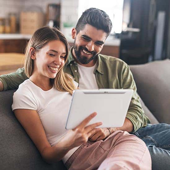 Couple reviewing finances online