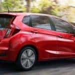 Red Honda Fit on City Street