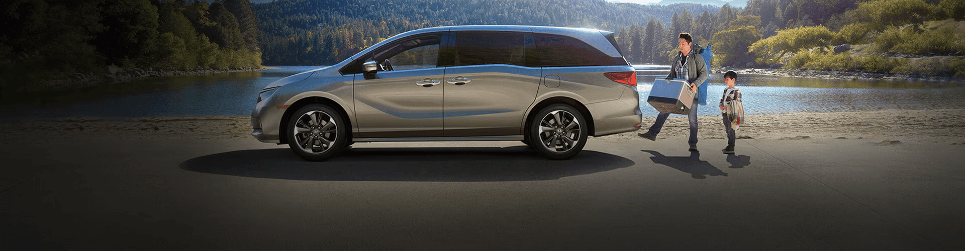 Father and son beside the Honda Odyssey