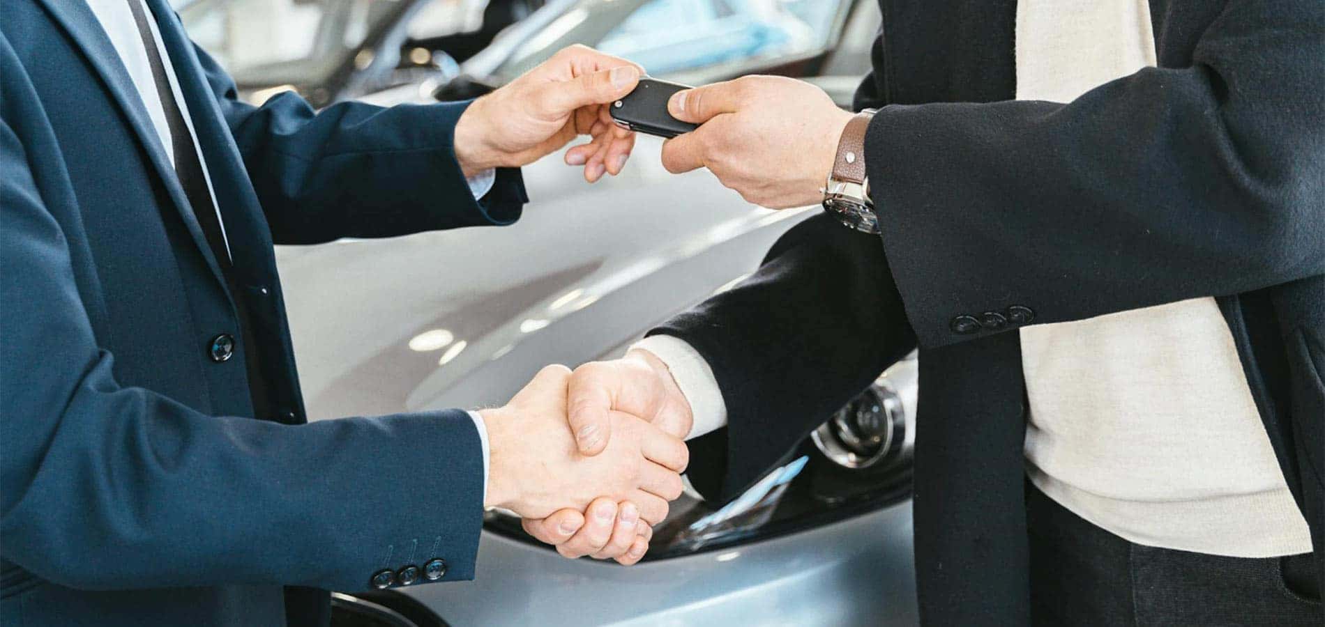 Shaking Hands in Car Dealership