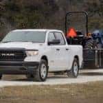 2019 RAM 1500 tows trailer with farm equipment