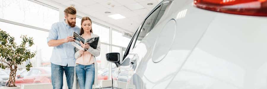 couple considering buying a car