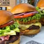 Three Burgers photographed with fries and drink