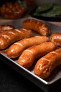 Freshly baked "Polish Boys," an Eastern European dish, sitting on a baking sheet