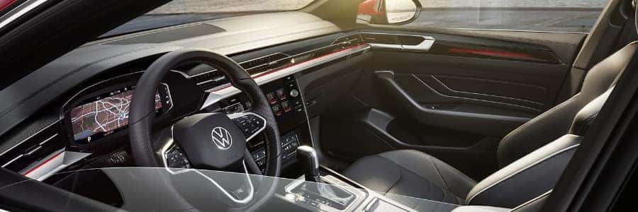 looking into the driver's side window of a 2022 VW Atreon, the interior is black leather