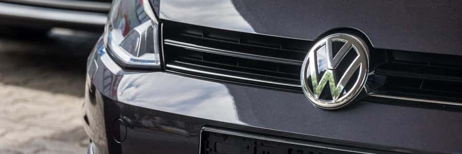 close up of vw logo on vw car