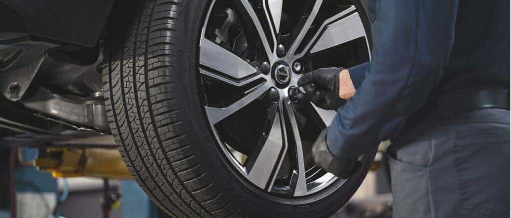 Technician installing Volvo tires in Gilbert, AZ