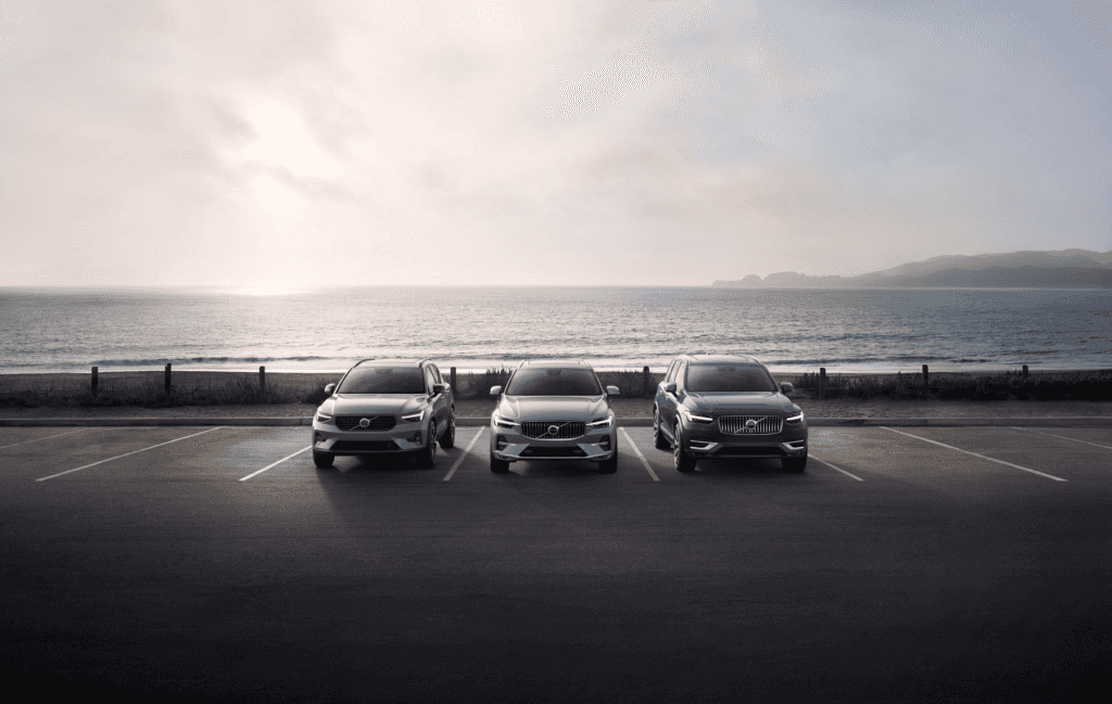 A group of pre-owned Volvo SUVs parked