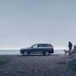 A Volvo lease vehicle parked on the shore