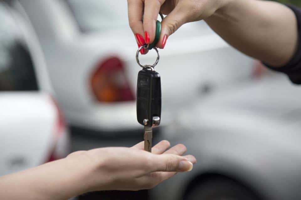 Handing car keys to the new owner