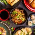 A table filled with Chinese food from a Milwaukee, WI, restaurant is shown.
